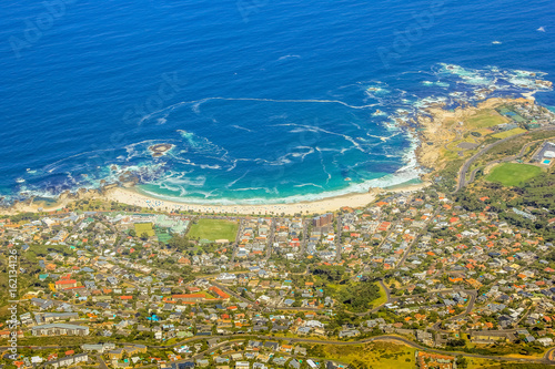 Aerial view of Camp's Bay Beach near Cape Town as seen from Lion's Head within the Table Mountain National Park, a popular destination in South Africa, Western Cape .
