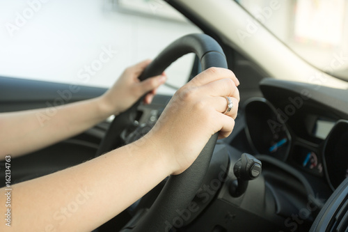 Closeup photo of woman driving car