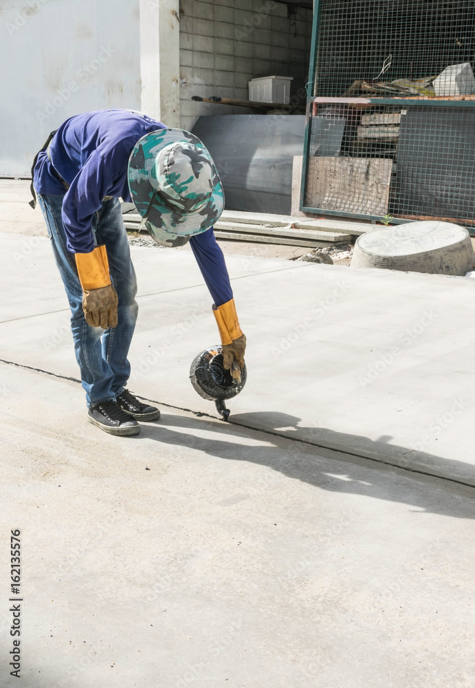 ROAD WORKER MAKING ASPHALT ON ROAD ROAD WORKER MAKING ASPHALT ON ROAD