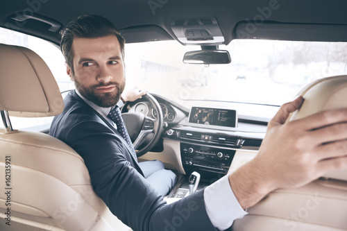  Young business man test drive new car