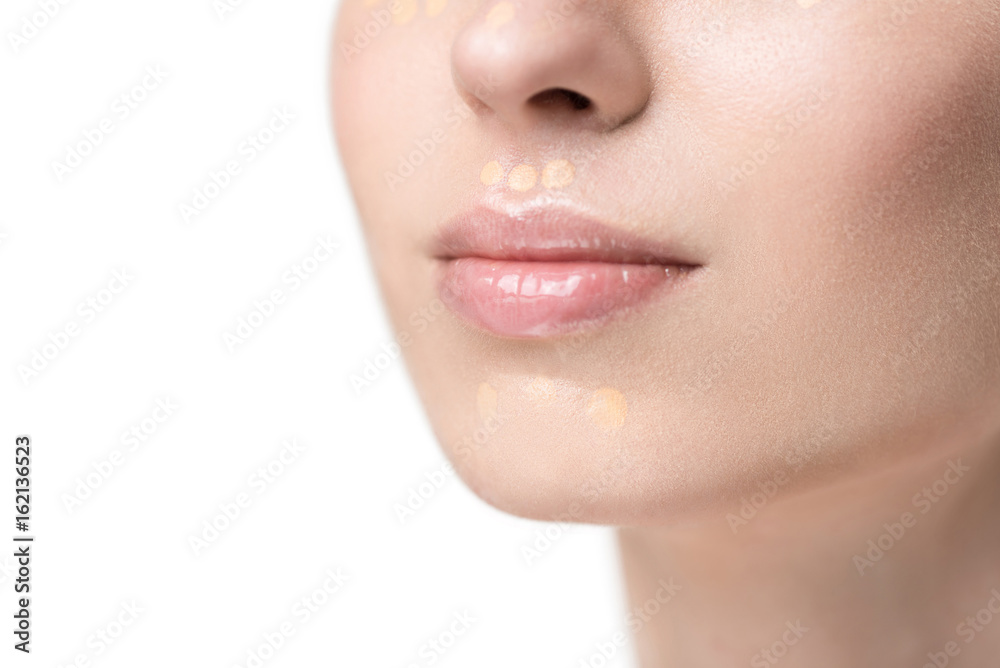 Pretty young lady using foundation Pretty young lady using foundation