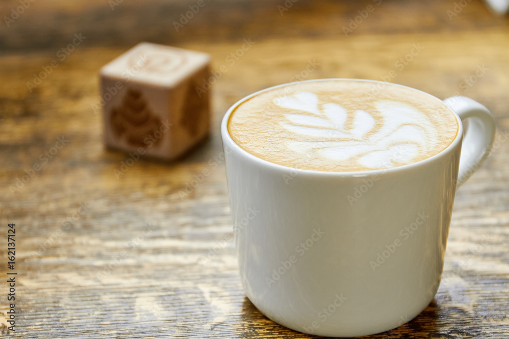Cup of latte macro. Coffee on blurred background. Cup of latte macro. Coffee on blurred background.
