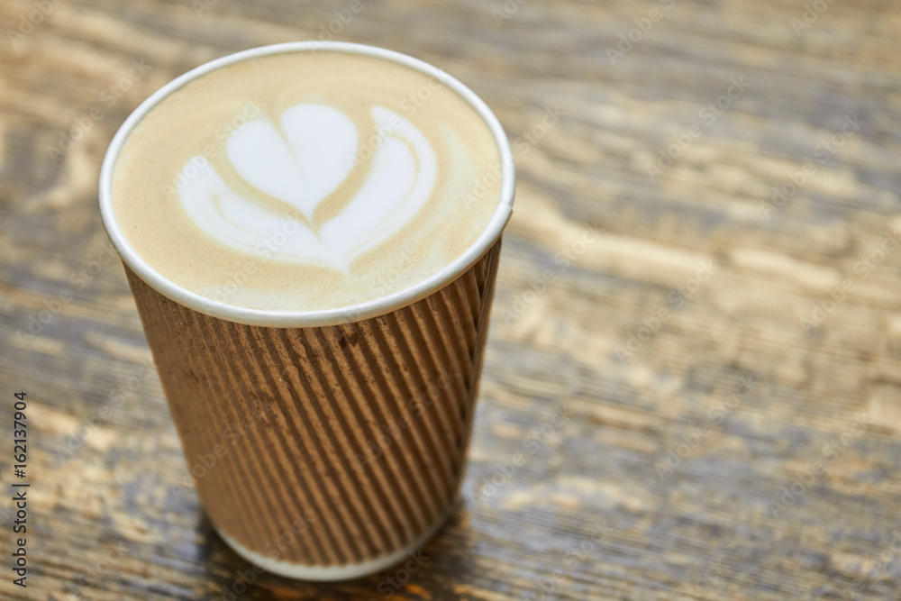 Latte art in paper cup. Coffee foam flower symbol. Stock Photo | Adobe ...