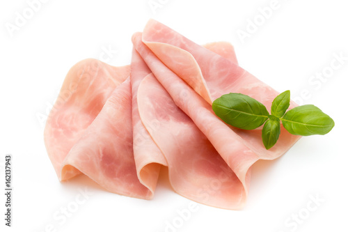 Thin slices of ham on white background. photo