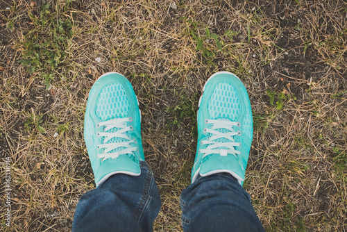 Closeup of running shoes on grass - concept image © pahis