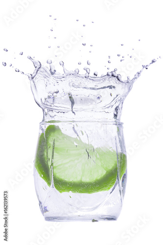 Green fruit in a glass with a drink