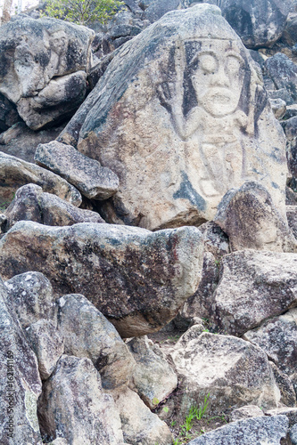 Figure carved in a rock located at El Chaquira site near San Agustin, Colombia