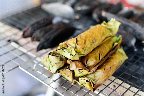 Grilled Sticky Rice in Banana Leaf on Stove Selective Focus