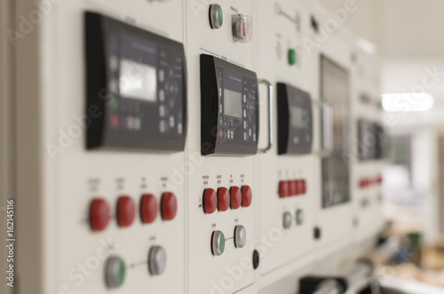 Main electric control board inside a factory (blurred picture)