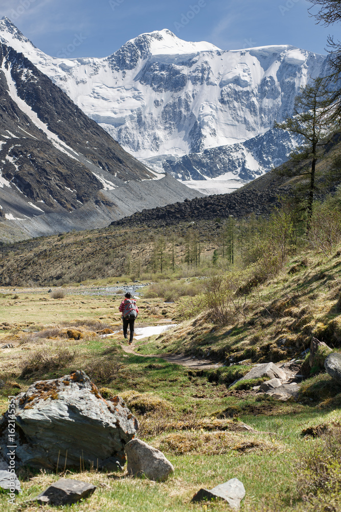 Traveller adventure hiking mountain with backpack and hat. Outdoor retrohipster lifestyle Traveller adventure hiking mountain with backpack and hat. Outdoor retrohipster lifestyle