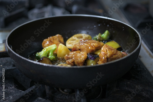 Chicken and vegetables intermix  in vinegar sauce © gexphos