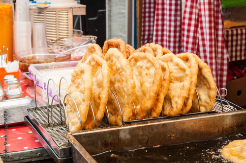 Traditional hungarian fried bread langos sold at a street vendor