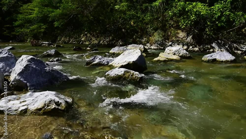 Genka River, the flow of water. Okinawa, Japan, Asia. Genka River, the flow of water. Okinawa, Japan, Asia.