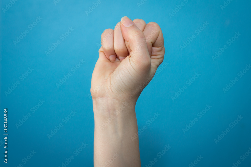 Woman hand holding fist up