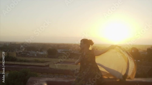 Young woman enjoy sun and wind photo