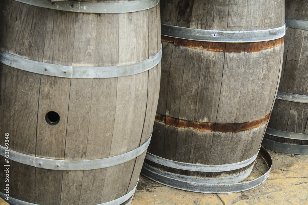 Old wooden barrels and tanks for processing wine Old wooden barrels and tanks for processing wine