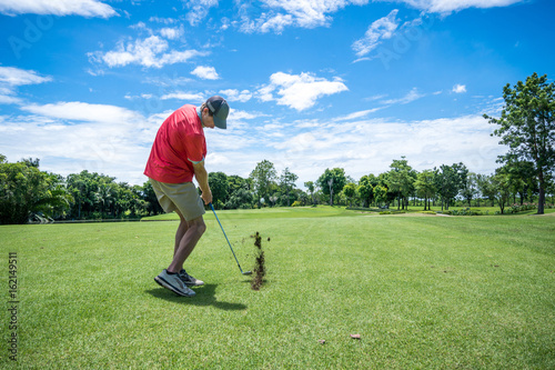 Картината върху платно golfer playing golf with golf club on fairway
