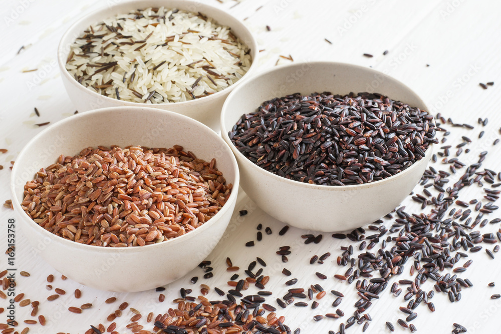 Selection of variety of gourmet rice in bowls. Selective focus Selection of variety of gourmet rice in bowls. Selective focus