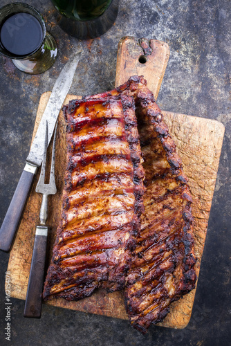 Barbecue Pork Spare Ribs as top view on an old cutting board