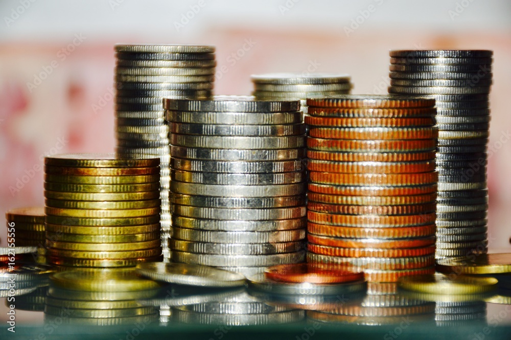 Stacks of coin,business finance and money concept.Abstract blurry background. Stacks of coin,business finance and money concept.Abstract blurry background.