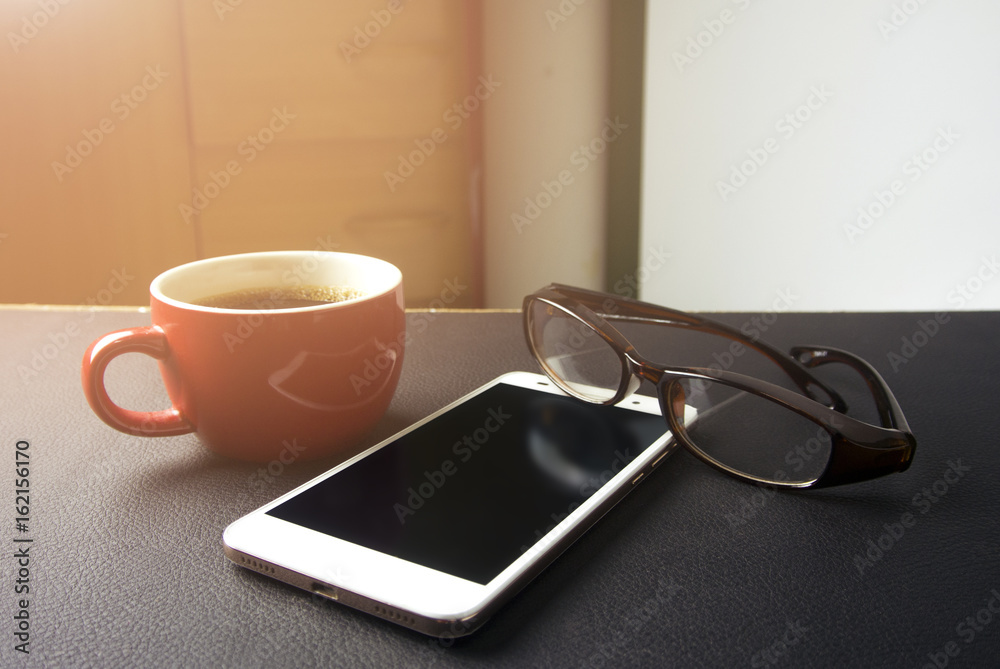 coffee with eyeglasses and mobile phone coffee with eyeglasses and mobile phone