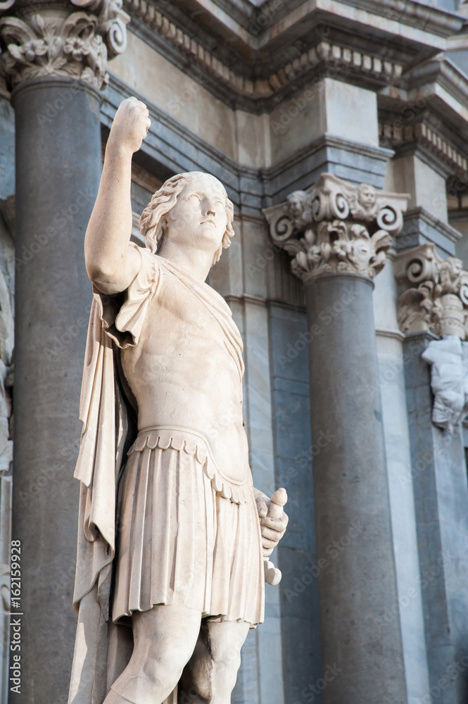 Obraz premium Night view of an external statue in the facade of Saint Agatha Church in Catania, Sicily