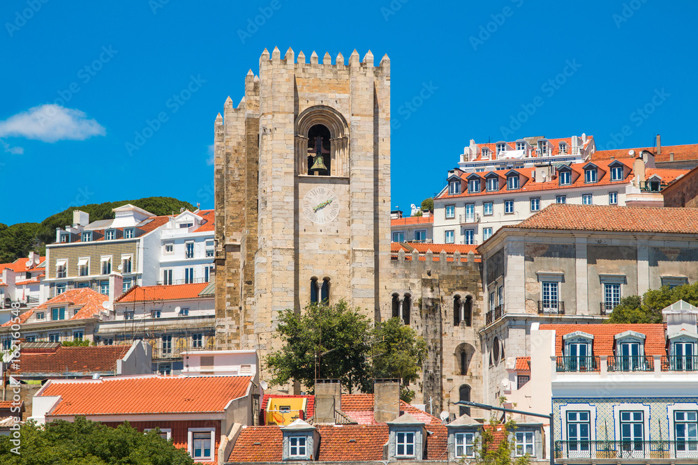      Tower bells of patriarchal Cathedral of St. Mary Major (Santa Maria Maior de Lisboa) and red roofs in Lisbon, Portugal 