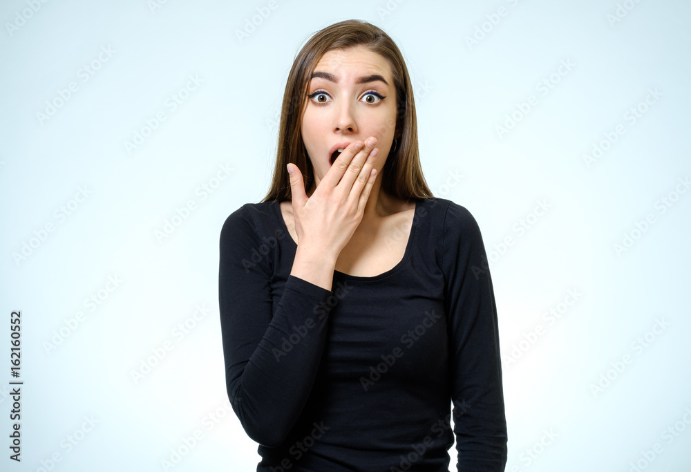 Portrait of a beautiful brunette girl with a surprised look Portrait of a beautiful brunette girl with a surprised look