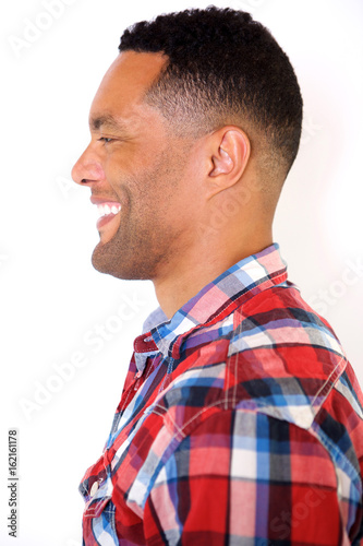 Side close up portrait of young african american guy laughing