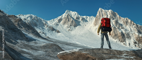 A man climbing up the mountain