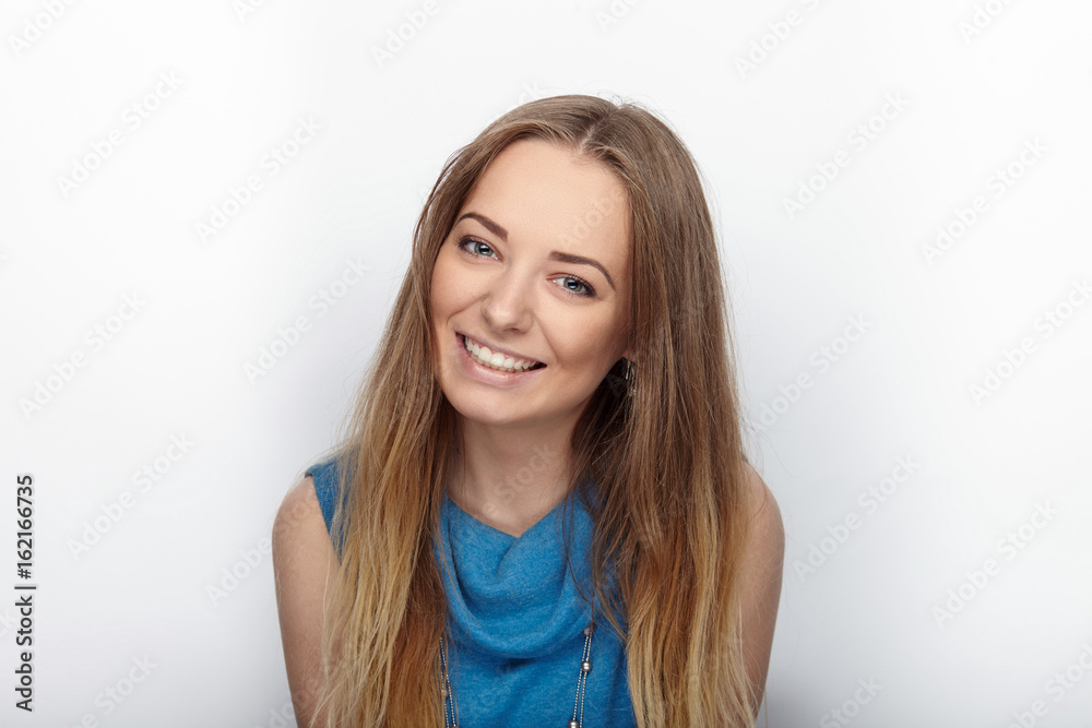 Headshot of young adorable blonde woman with cute smile on white background Headshot of young adorable blonde woman with cute smile on white background
