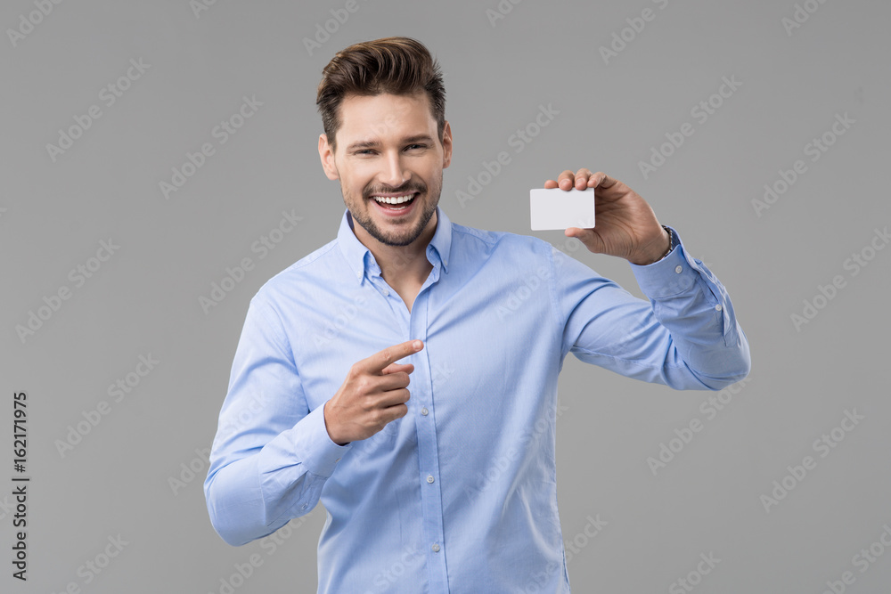 custom made wallpaper toronto digitalHandsome man in blue shirt  with white card