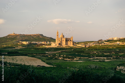 Gozo, Malta. Our Lady of Ta Pinu Basilica viewed from Gharb village at sunset