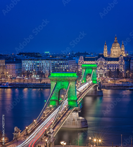 Chain Bridge with green lights on St. Patrick's day in Budapest