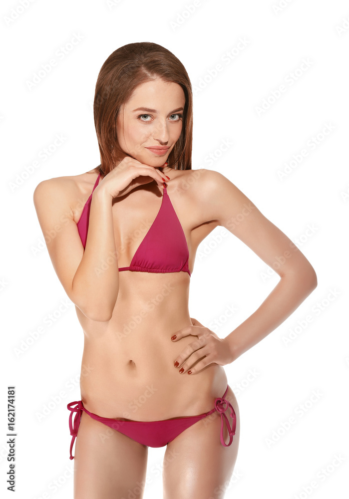 Fototapeta premium Beautiful young woman in swimsuit on white background