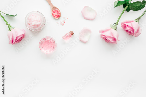 homemade spa with rose cosmetic set  cream  salt and oil on white background top view mock-up