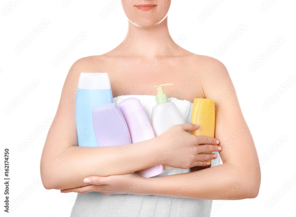 Young woman after shower with cosmetic products on white background, closeup Young woman after shower with cosmetic products on white background, closeup