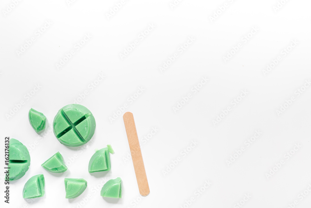 Wax for depilation on white background top view copyspace Wax for depilation on white background top view copyspace