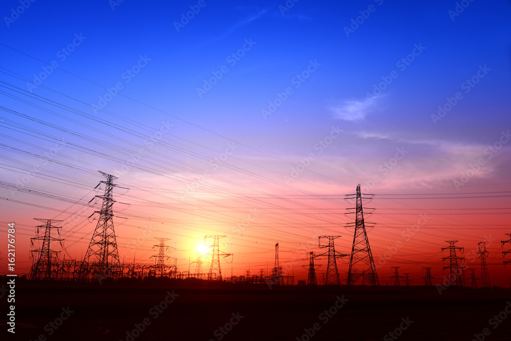 High piezoelectric towers, in the setting sun