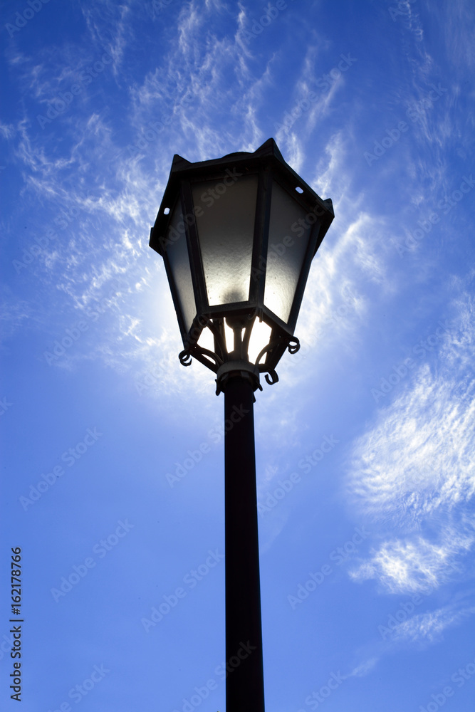 Lamppost in backlight on sky