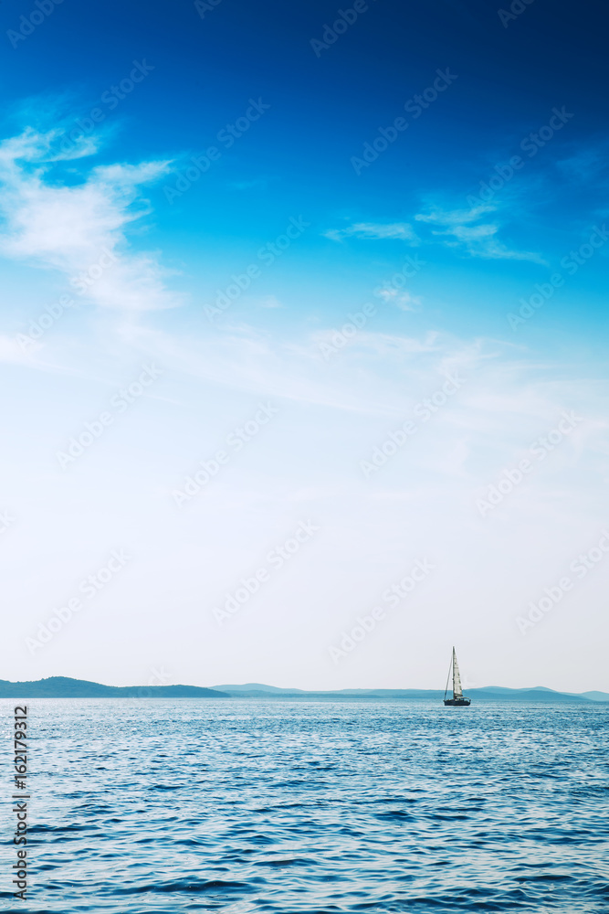 Fototapeta premium Yacht sailing in blue sea.