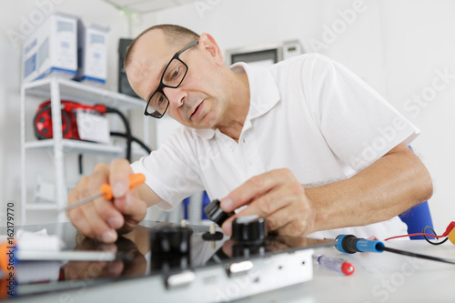handyman repairing appliances