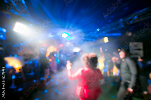 Blurred colorful lights inside music club