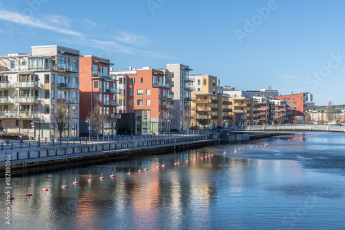 Uppskattade bostadshus i Hammarby sjöstad byggda vid kajen eller vid strandpromenaden photo
