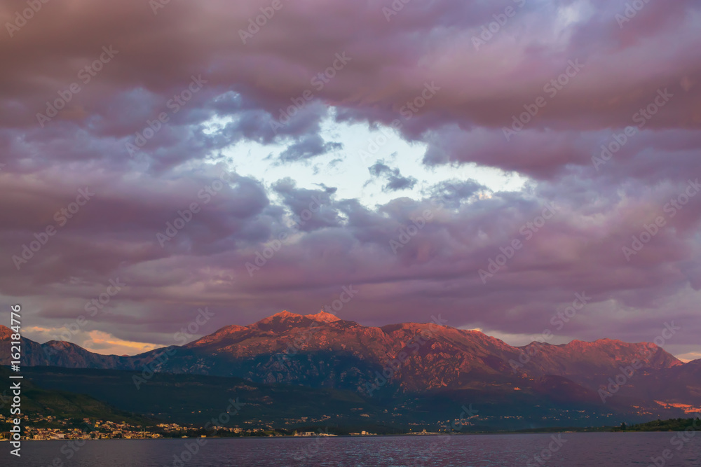 Sunset in the sky of Montenegro over the high mountains.
