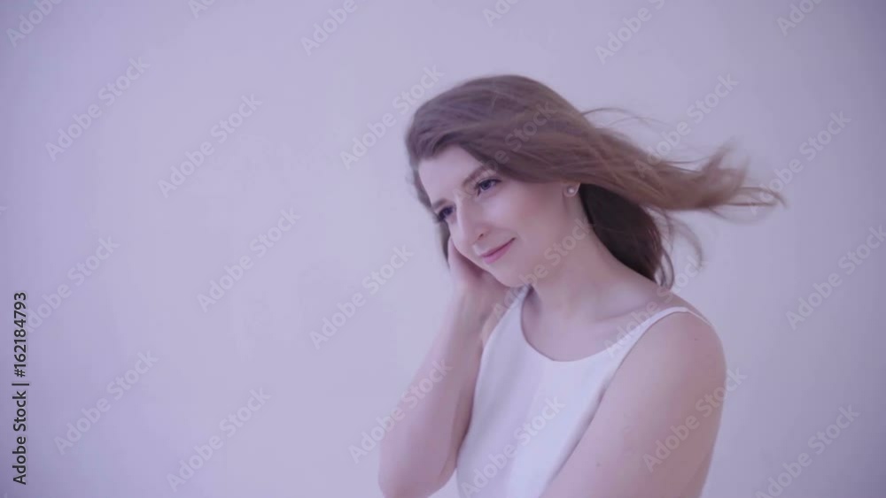 Beautiful sexy young woman with blowing hair