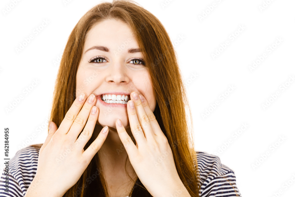 Portrait of beautiful young woman showing teeth Portrait of beautiful young woman showing teeth