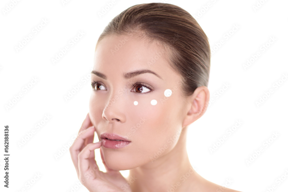 Eye cream face skin care woman putting eyebag wrinkles care anti aging treatment. Skincare Asian beauty touching in studio isolated on white background. Natural makeup spa clear and clean skin. Eye cream face skin care woman putting eyebag wrinkles care anti aging treatment. Skincare Asian beauty touching in studio isolated on white background. Natural makeup spa clear and clean skin.