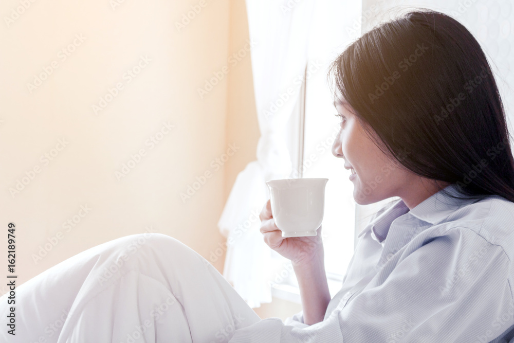 woman drinking coffee on bed woman drinking coffee on bed