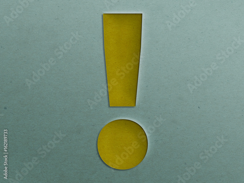 Paper Cut Exclamation Mark on the Grunge Paper